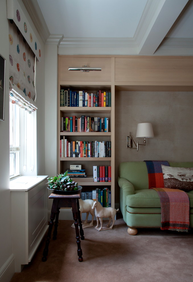 Mid-sized transitional enclosed family room in New York with a library, beige walls, carpet and a built-in media wall.