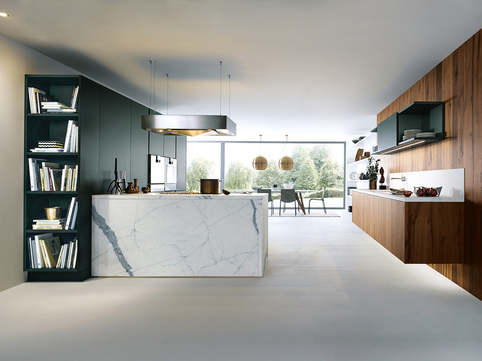 Contemporary l-shaped open plan kitchen in Nuremberg with flat-panel cabinets, green cabinets, timber splashback, a peninsula, white benchtop and stainless steel appliances.