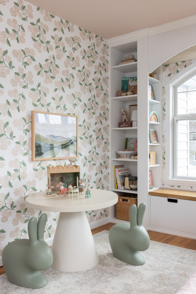 Playful Garden Bedroom - Example of a girl wallpaper toddler room design in New York
