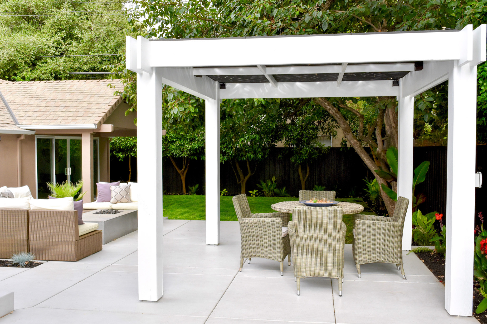 Custom Pergola with Artistic Cut-Out Trellis and Inviting Outdoor Spaces