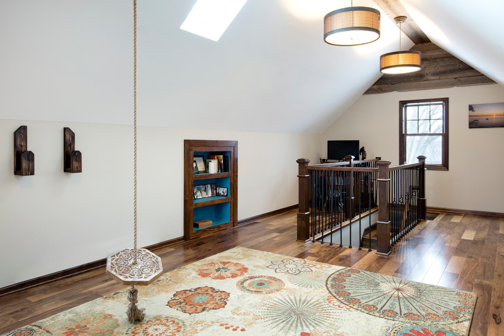 Design ideas for an expansive transitional master bedroom in Minneapolis with grey walls and medium hardwood floors.