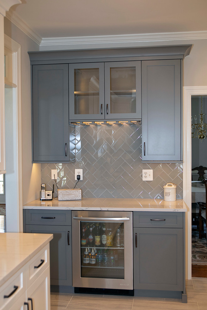 Kitchen - large transitional u-shaped kitchen idea in DC Metro with shaker cabinets, white cabinets and an island