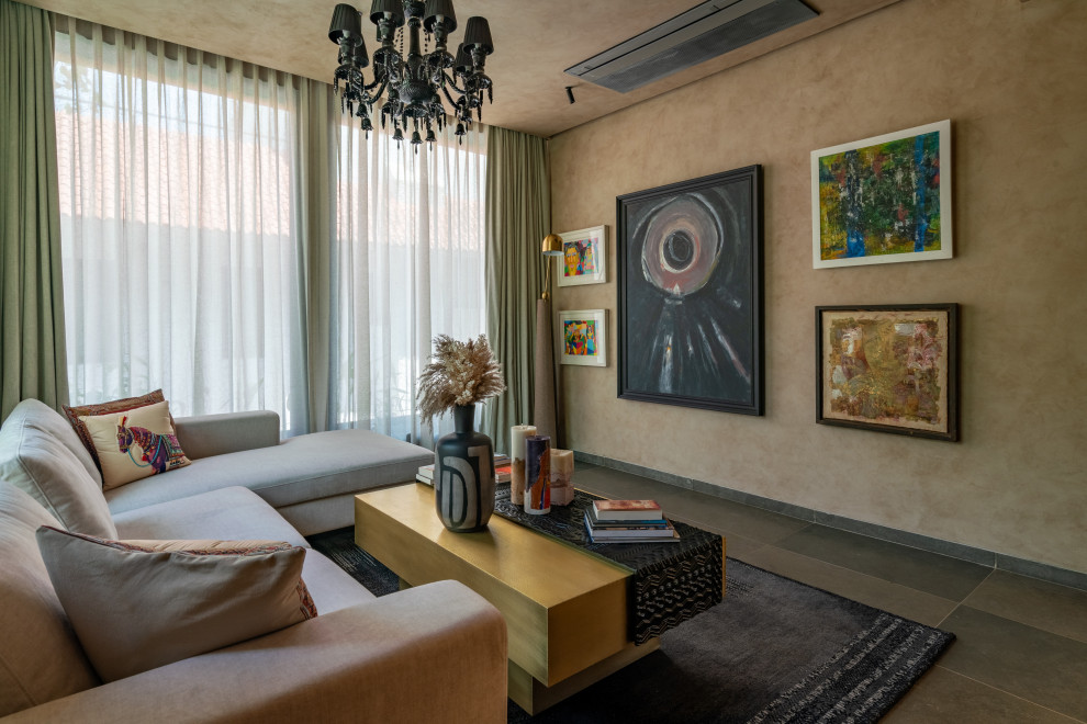This is an example of a contemporary living room in Hyderabad With Beige Walls and Gray.