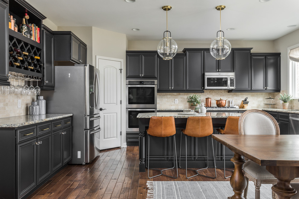 Eat-in kitchen - large transitional u-shaped dark wood floor and brown floor eat-in kitchen idea in Indianapolis with an undermount sink, beaded inset cabinets, black cabinets, beige backsplash, stone tile backsplash, stainless steel appliances, an island and gray countertops