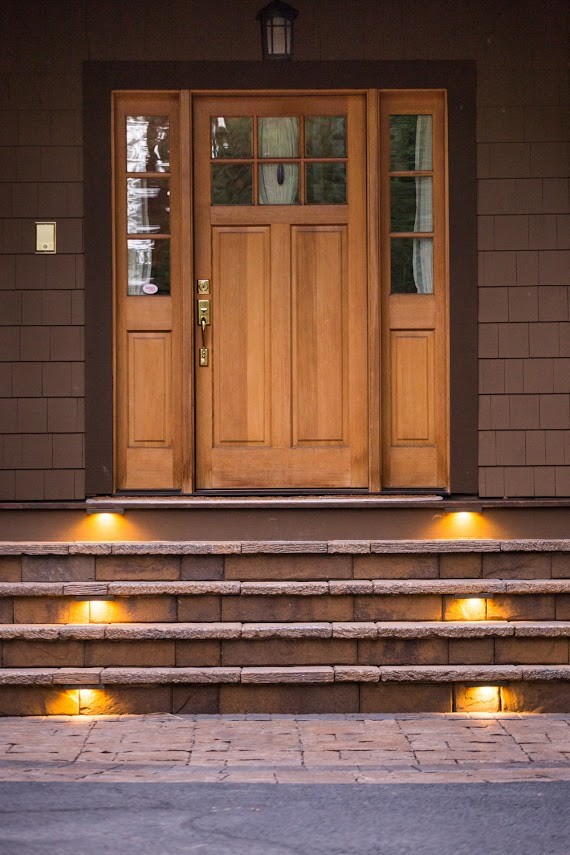 Design ideas for a large country front door in Portland with a single front door and a light wood front door.