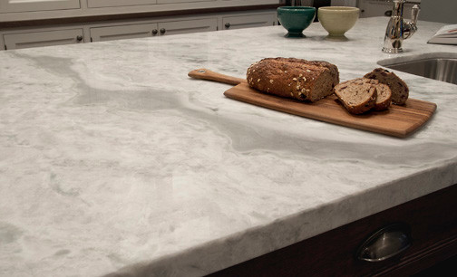 Inspiration for a large transitional medium tone wood floor eat-in kitchen remodel in Toronto with beaded inset cabinets, white cabinets, quartzite countertops, multicolored backsplash, stone tile backsplash, black appliances and an island