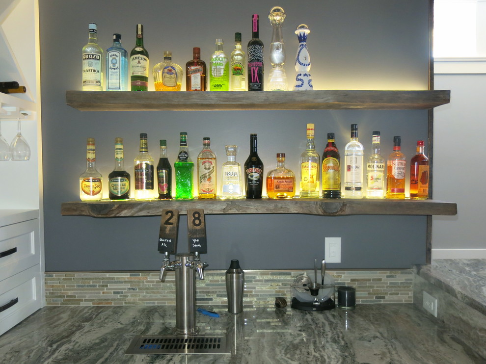 Photo of a mid-sized transitional u-shaped seated home bar in Chicago with an undermount sink, shaker cabinets, white cabinets, granite benchtops, multi-coloured splashback, glass tile splashback and porcelain floors.