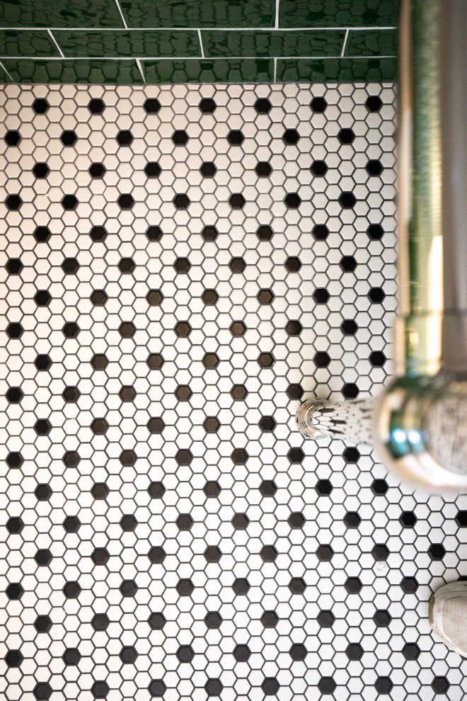 Mid-sized transitional green tile and ceramic tile mosaic tile floor, multicolored floor and wallpaper powder room photo with a one-piece toilet, green walls, an undermount sink, solid surface countertops and white countertops