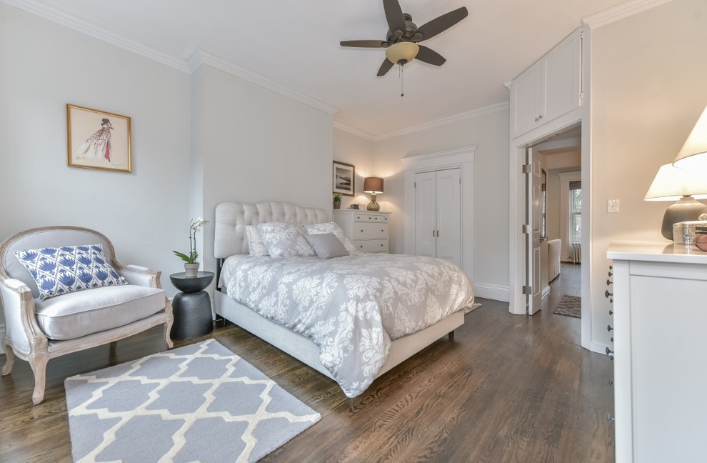 Inspiration for a mid-sized transitional master bedroom in Boston with grey walls, dark hardwood floors, no fireplace and brown floor.