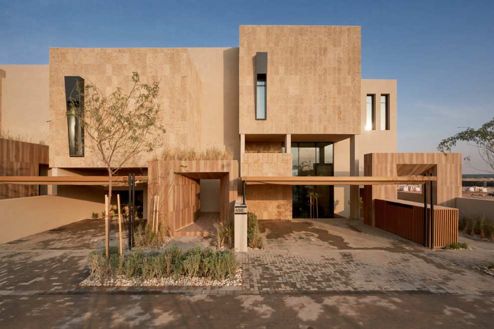 Idee per la villa beige contemporanea a due piani con tetto piano