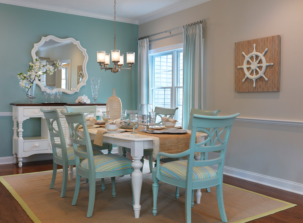 Inspiration for a mid-sized beach style dining room in Boston with blue walls and medium hardwood floors.