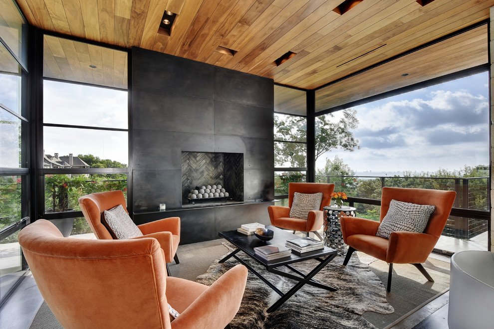 Design ideas for a contemporary sunroom in Austin with a standard fireplace, a metal fireplace surround and a standard ceiling.