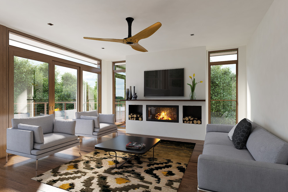 Photo of a mid-sized contemporary formal open concept living room in Melbourne with white walls, medium hardwood floors, a wall-mounted tv and a ribbon fireplace.