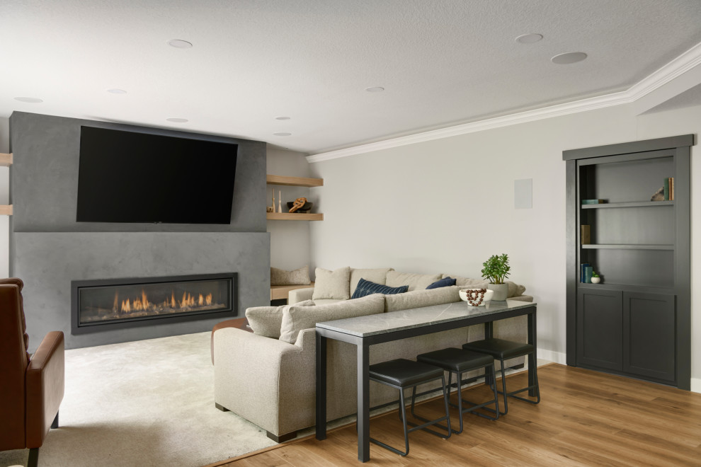 Design ideas for a medium sized open plan living room in Other with a home bar, beige walls, vinyl flooring, a standard fireplace, a concrete fireplace surround, a wall mounted tv, brown floors and exposed beams.