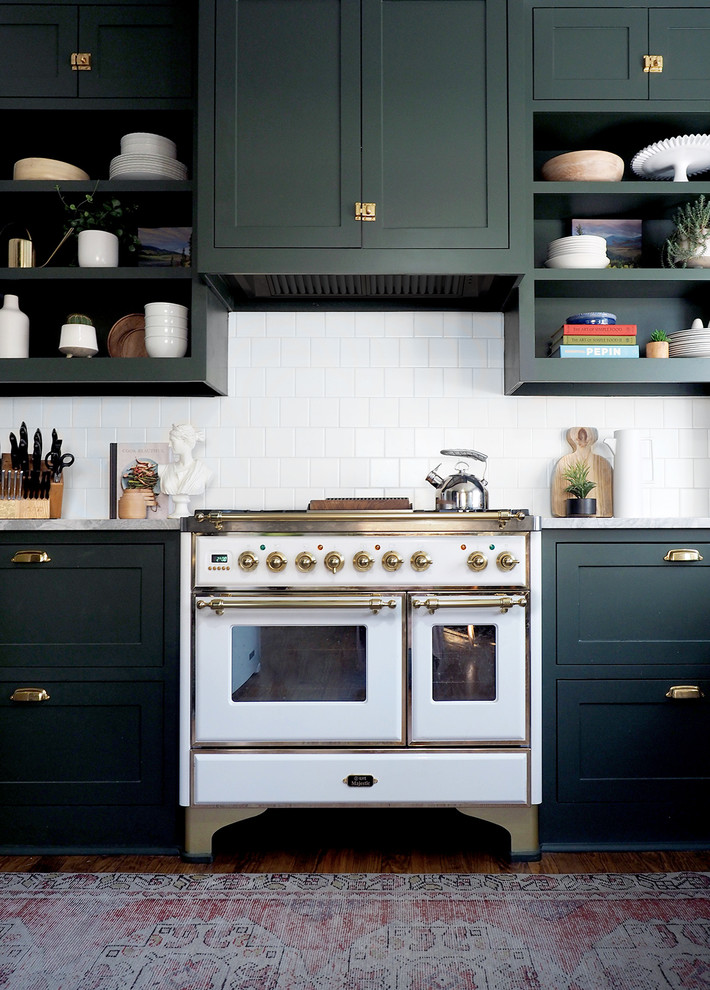 Inspiration for a small transitional l-shaped kitchen in Dallas with shaker cabinets, green cabinets, white splashback and dark hardwood floors.