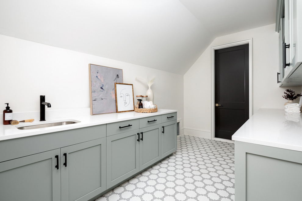 This is an example of a transitional laundry room in Charlotte.