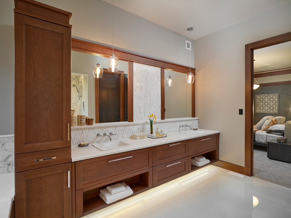 Inspiration for a large transitional master bathroom remodel in Edmonton with recessed-panel cabinets, medium tone wood cabinets and quartz countertops