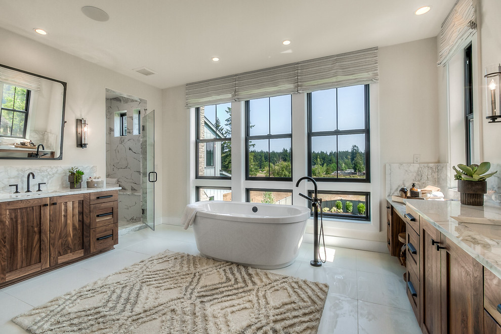 Photo of a transitional master bathroom in Seattle with a freestanding tub, an alcove shower, an undermount sink, white floor, a hinged shower door, grey benchtops, shaker cabinets, dark wood cabinets and grey walls.