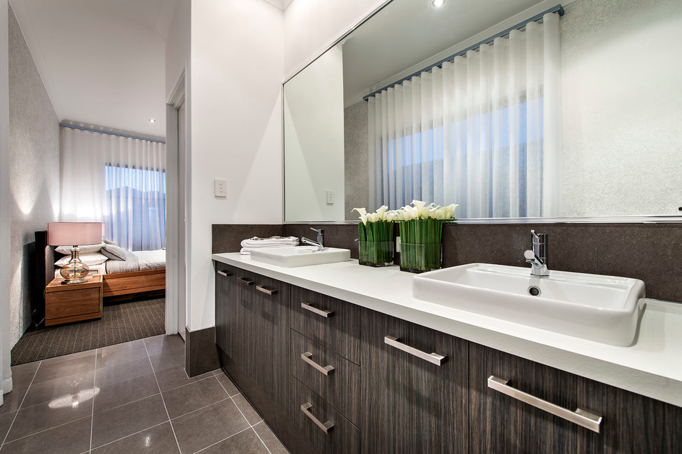 This is an example of a contemporary bathroom in Perth with a drop-in sink, flat-panel cabinets, dark wood cabinets and white walls.