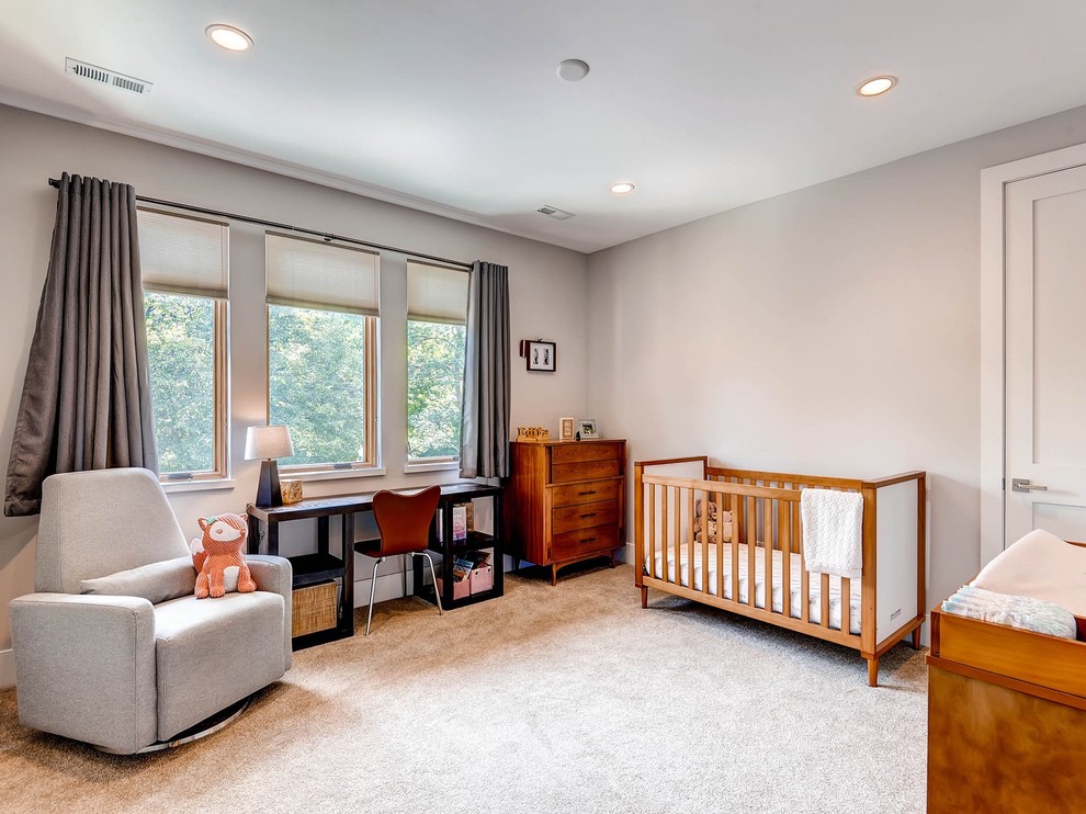 Photo of a contemporary nursery in Denver with beige floor.