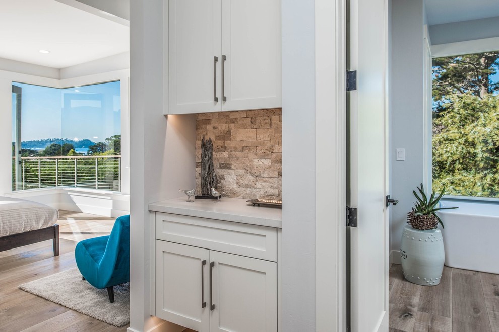 Mid-sized transitional medium tone wood floor hallway photo in Orange County with gray walls