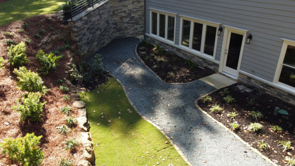 This is an example of a transitional garden in Atlanta with gravel.