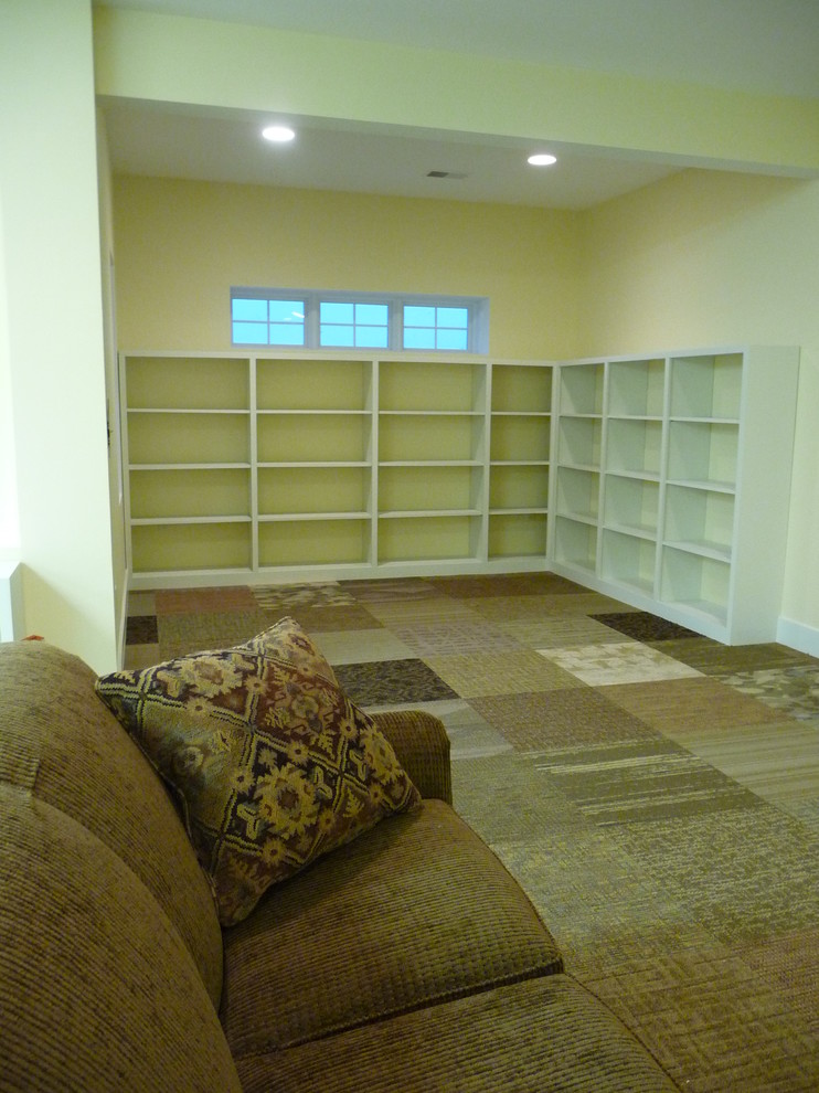 Inspiration for a large transitional look-out carpeted basement remodel with yellow walls