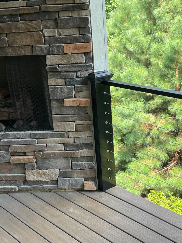 Inspiration for a mid-sized modern backyard second story metal railing deck remodel