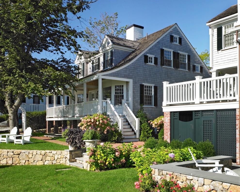 Mid-sized beach style two-storey exterior in Boston with wood siding and a gable roof.