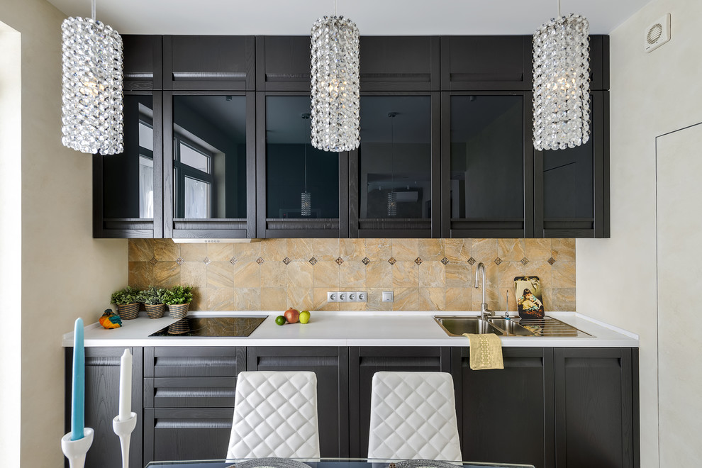 Mid-sized contemporary galley eat-in kitchen in Moscow with a drop-in sink, raised-panel cabinets, black cabinets, brown splashback and no island.