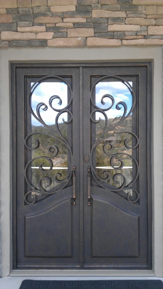 Design ideas for a mid-sized traditional front door in Phoenix with beige walls, a double front door and a metal front door.