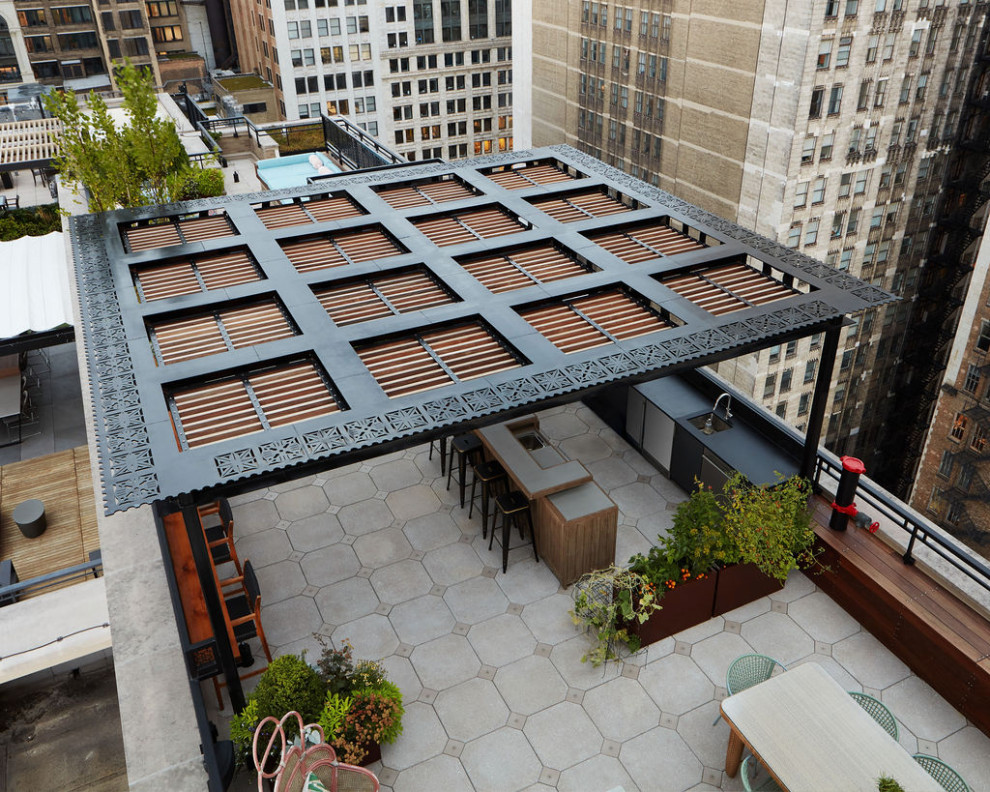 Inspiration for a large modern roof rooftop metal railing terrace in Chicago with an outdoor kitchen and a pergola.