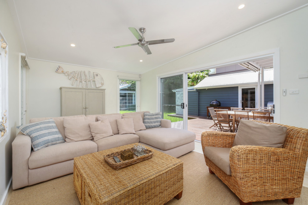This is an example of a beach style living room in Central Coast.
