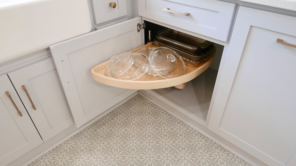 Inspiration for a mid-sized transitional u-shaped ceramic tile and multicolored floor eat-in kitchen remodel with a farmhouse sink, shaker cabinets, gray cabinets, quartz countertops, multicolored backsplash, marble backsplash, stainless steel appliances, a peninsula and white countertops