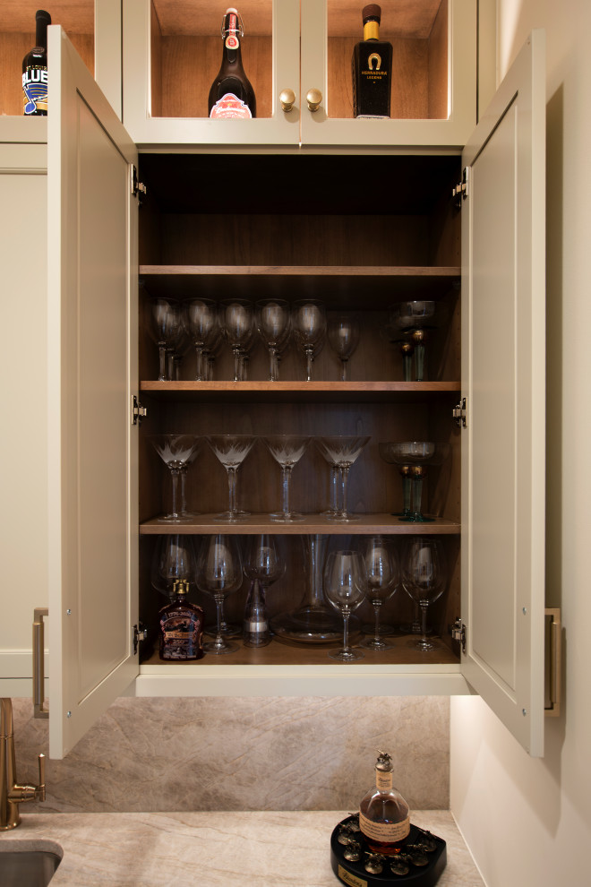 Large transitional l-shaped dark wood floor and brown floor open concept kitchen photo in Nashville with an undermount sink, beaded inset cabinets, white cabinets, quartzite countertops, beige backsplash, stone slab backsplash, stainless steel appliances, an island and beige countertops