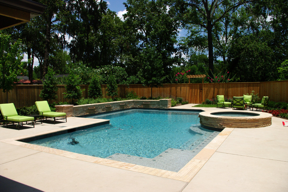 Photo of a large contemporary backyard rectangular lap pool in Houston with a hot tub and concrete pavers.