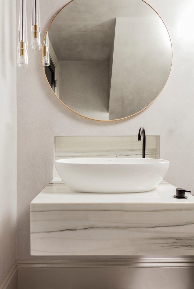 Inspiration for a small transitional powder room in Boston with a one-piece toilet, grey walls, mosaic tile floors, a vessel sink, marble benchtops and grey floor.