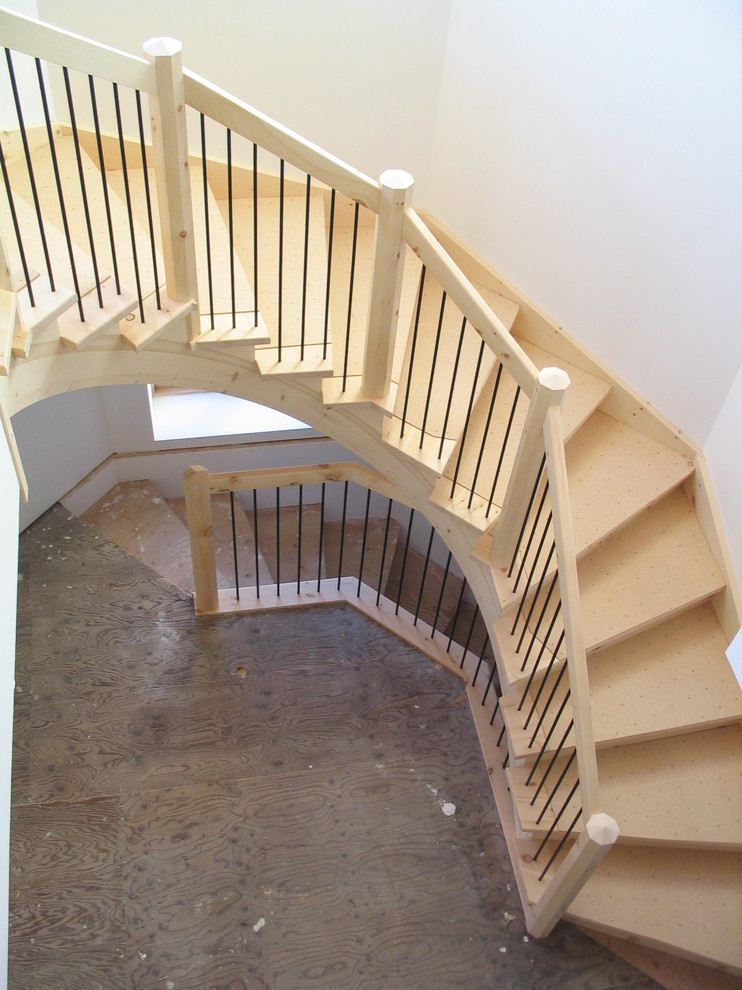Huge mountain style wooden curved staircase photo with wooden risers