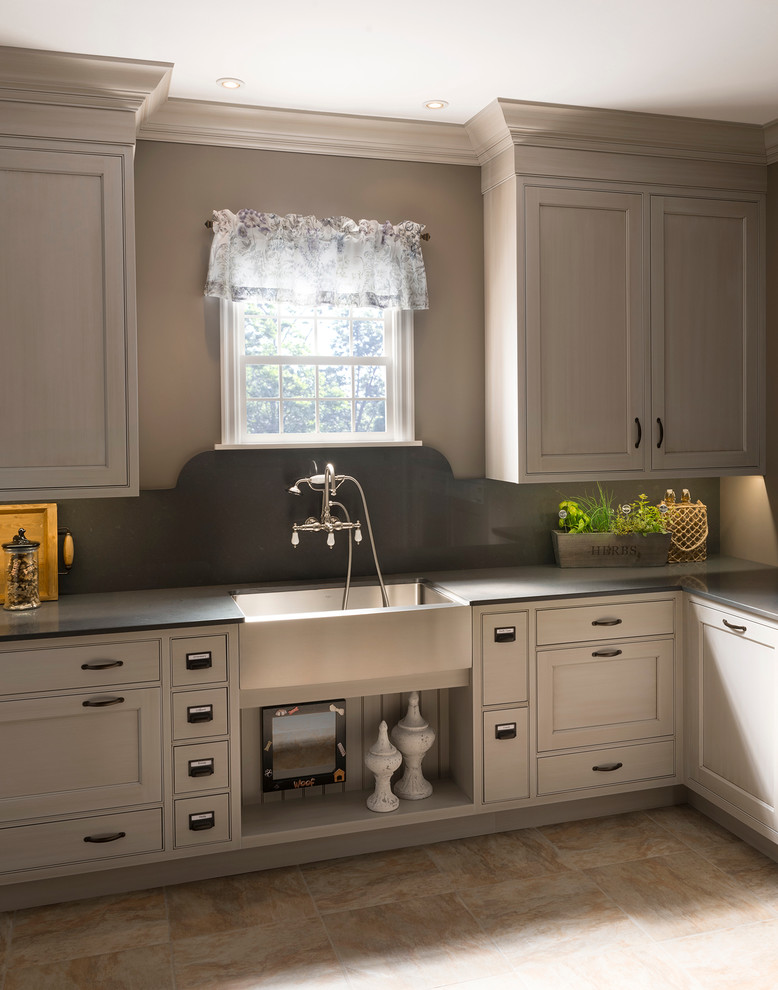 This is an example of a laundry room in Other with white cabinets.