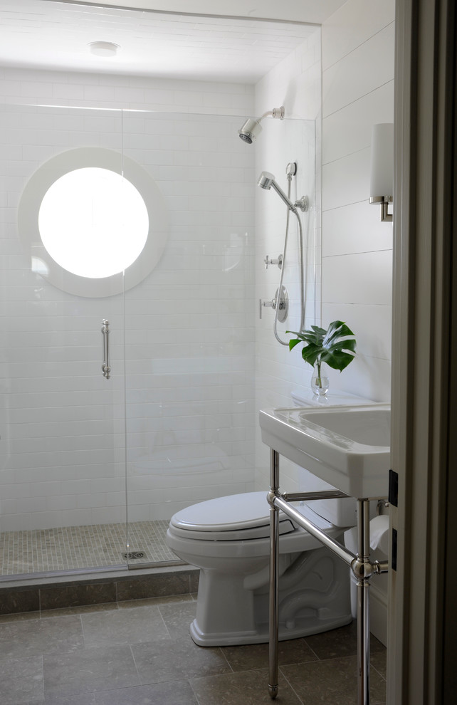 Transitional bathroom in New York with a console sink and an alcove shower.
