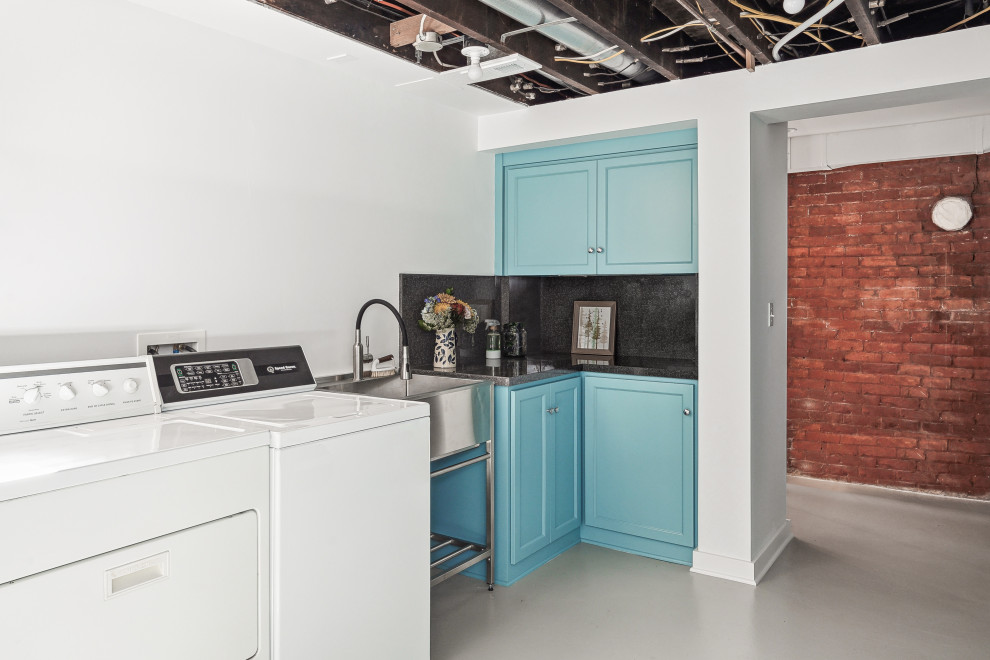 Design ideas for a medium sized traditional galley utility room in Portland with a built-in sink, recessed-panel cabinets, blue cabinets, laminate countertops, white walls, concrete flooring, a side by side washer and dryer, grey floors and black worktops.