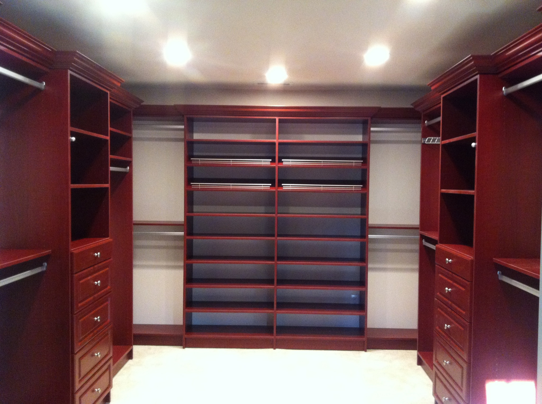 This closet is a cherry wood grain.  The back wall is a shoe wall and flanked by two double hang.