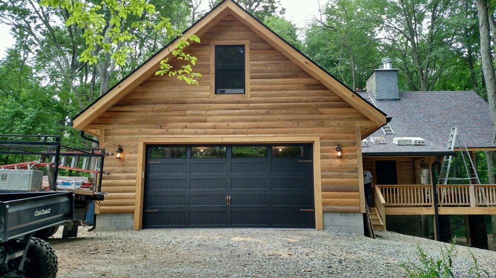 Inspiration for a large country attached two-car garage in Cleveland.