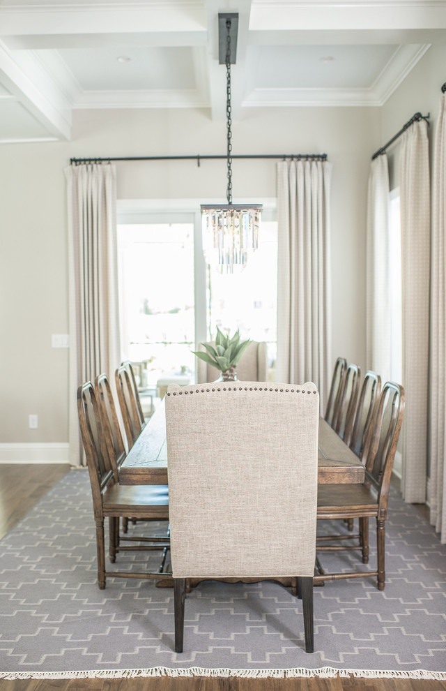 Photo of a large transitional open plan dining in Orlando with beige walls, dark hardwood floors and brown floor.