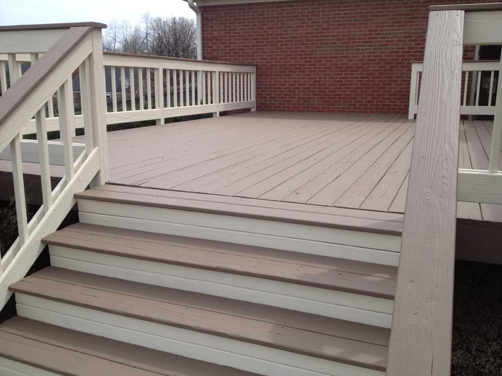 This is an example of a large traditional backyard deck in Louisville with no cover.