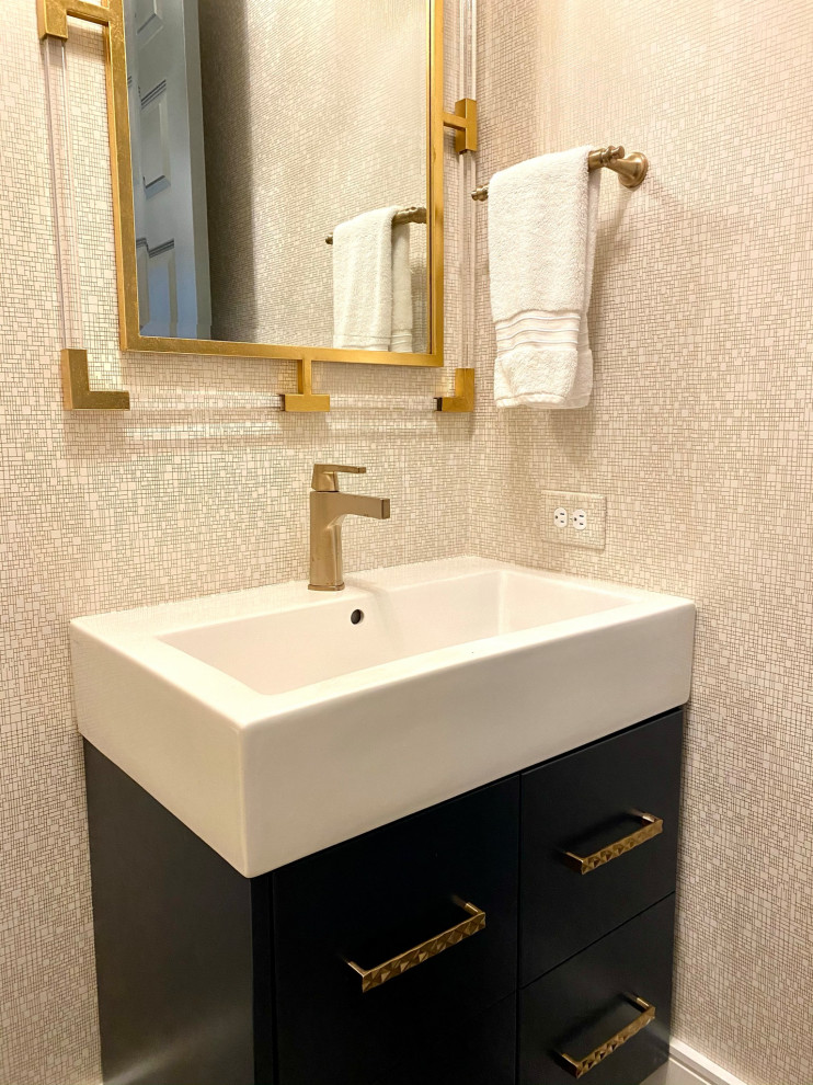 Photo of a small contemporary cloakroom in Raleigh with blue cabinets, a one-piece toilet, white walls, laminate floors, brown floors, a built in vanity unit, wallpapered walls, flat-panel cabinets and white worktops.