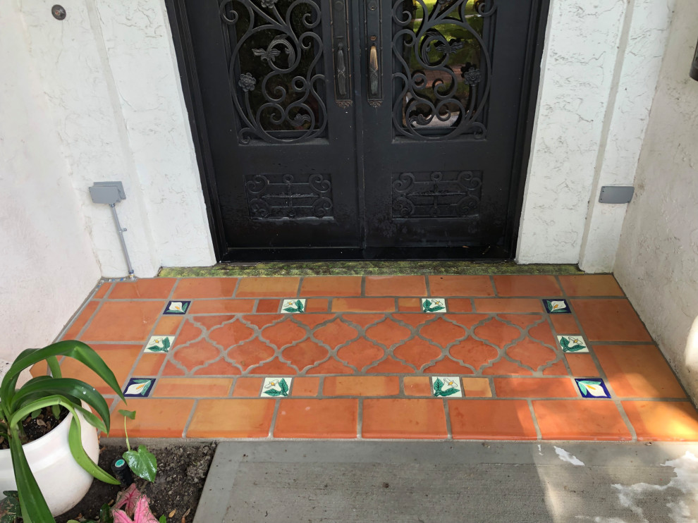 Photo of a mid-sized mediterranean front yard patio in Houston with tile.