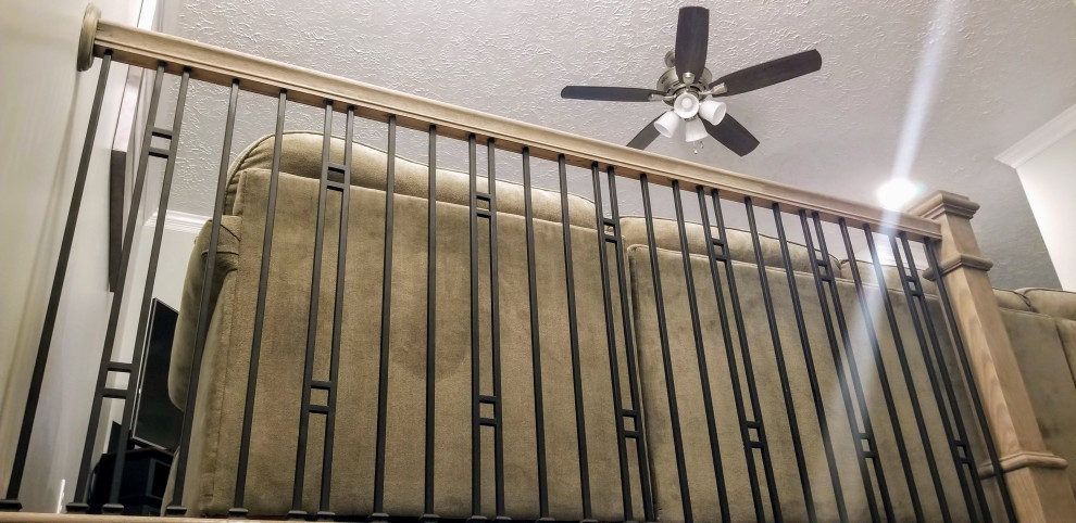Inspiration for a mid-sized transitional painted l-shaped metal railing staircase remodel with wooden risers