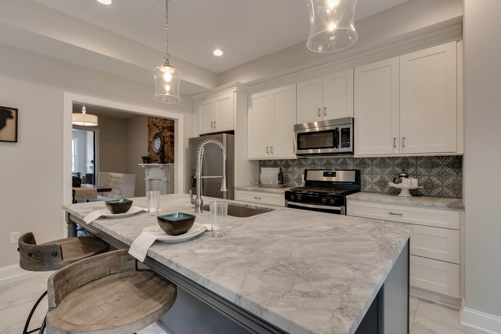 Mid-sized transitional single-wall kitchen in Richmond with an undermount sink, shaker cabinets, white cabinets, stainless steel appliances, with island and white benchtop.