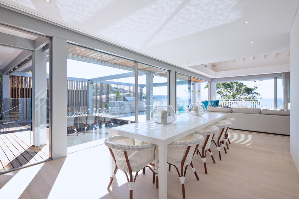 Design ideas for an expansive beach style open plan dining in Sydney.